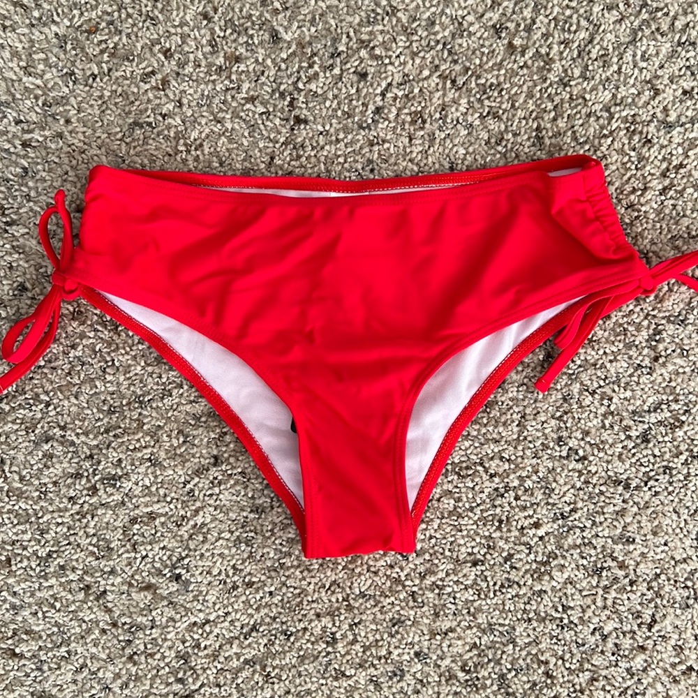 Brand new! Red cheeky swimsuit bottoms. Size Medium.